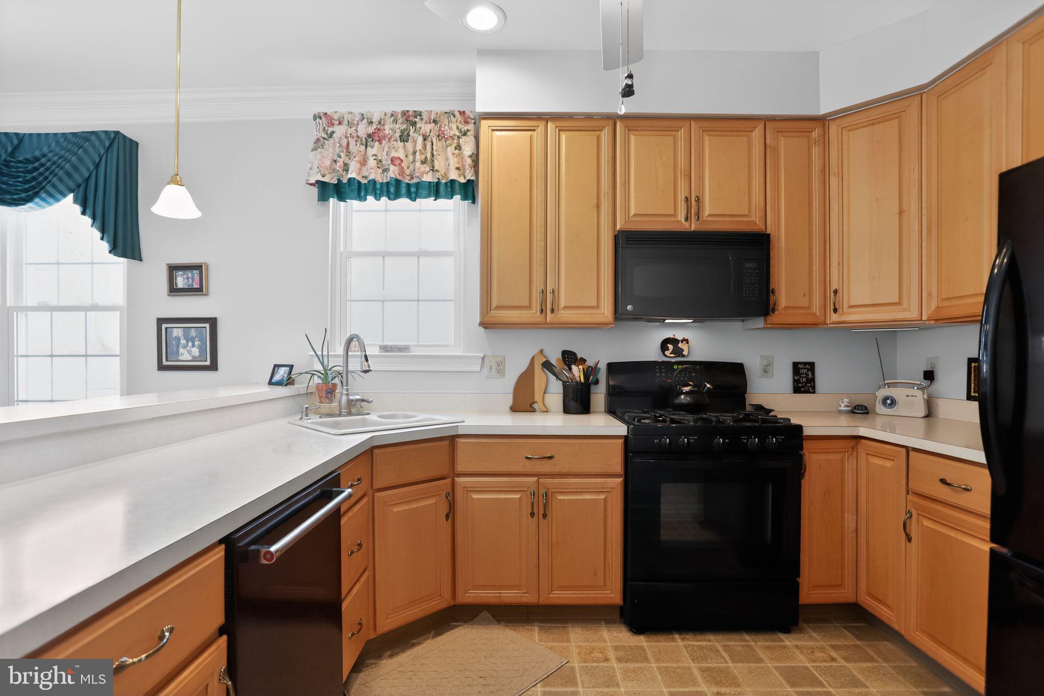417 Ruth Court Harleysville, PA 19438 - Photo 7 of 28 a kitchen with a sink stove top oven and cabinets