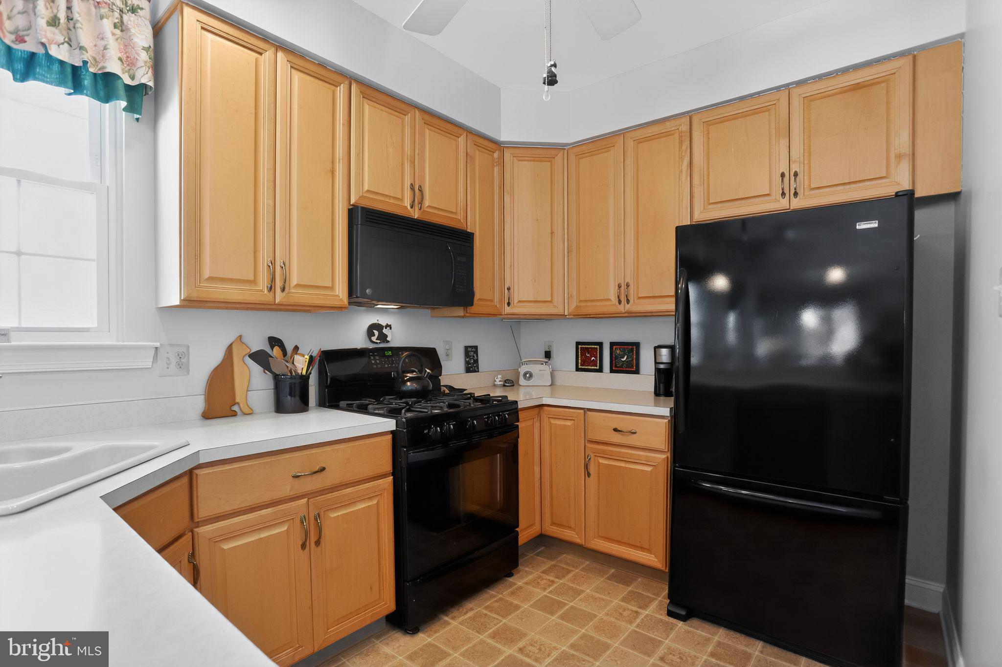 417 Ruth Court Harleysville, PA 19438 - Photo 8 of 28 a kitchen with stainless steel appliances granite countertop a refrigerator stove a sink dishwasher and microwave with cabinets