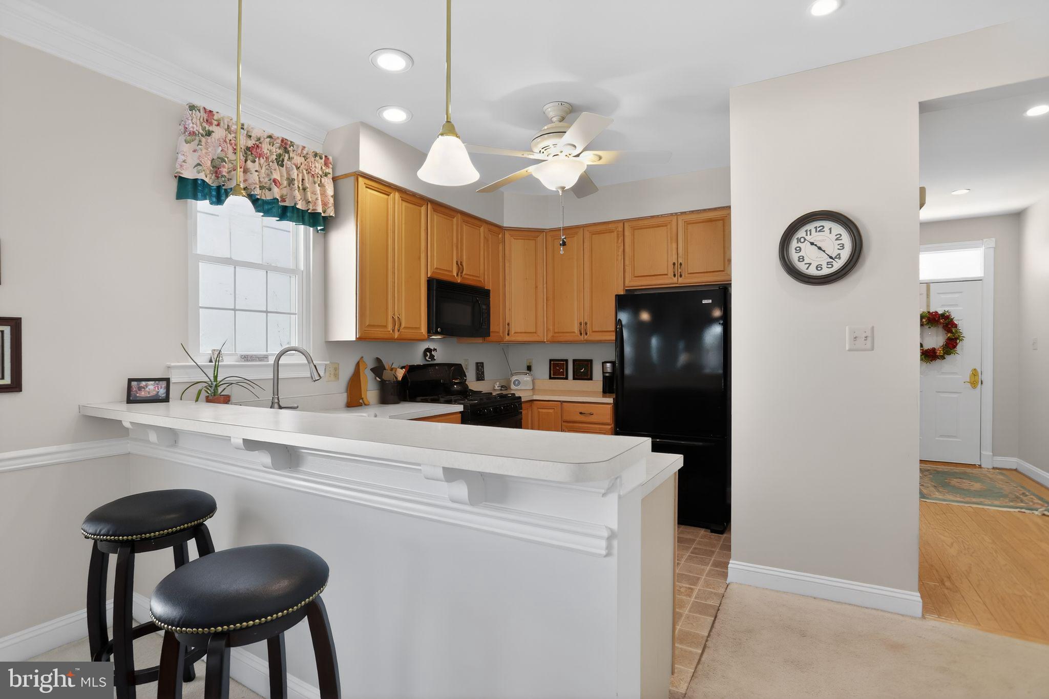 417 Ruth Court Harleysville, PA 19438 - Photo 10 of 28 a kitchen with a refrigerator a sink cabinets and furniture