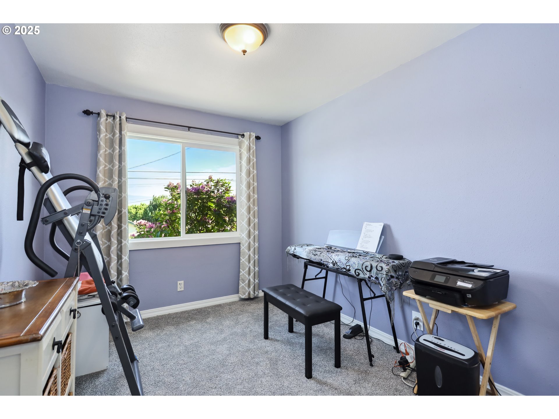 722 East 14th Street The Dalles, OR 97058 - Photo 14 of 43 a view of a workspace with furniture and a window