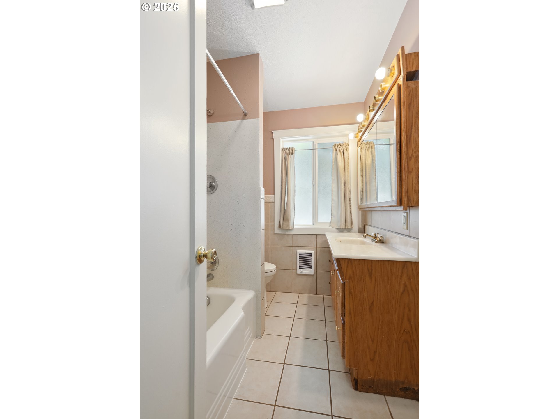 722 East 14th Street The Dalles, OR 97058 - Photo 20 of 43 a bathroom with a sink a toilet and a mirror