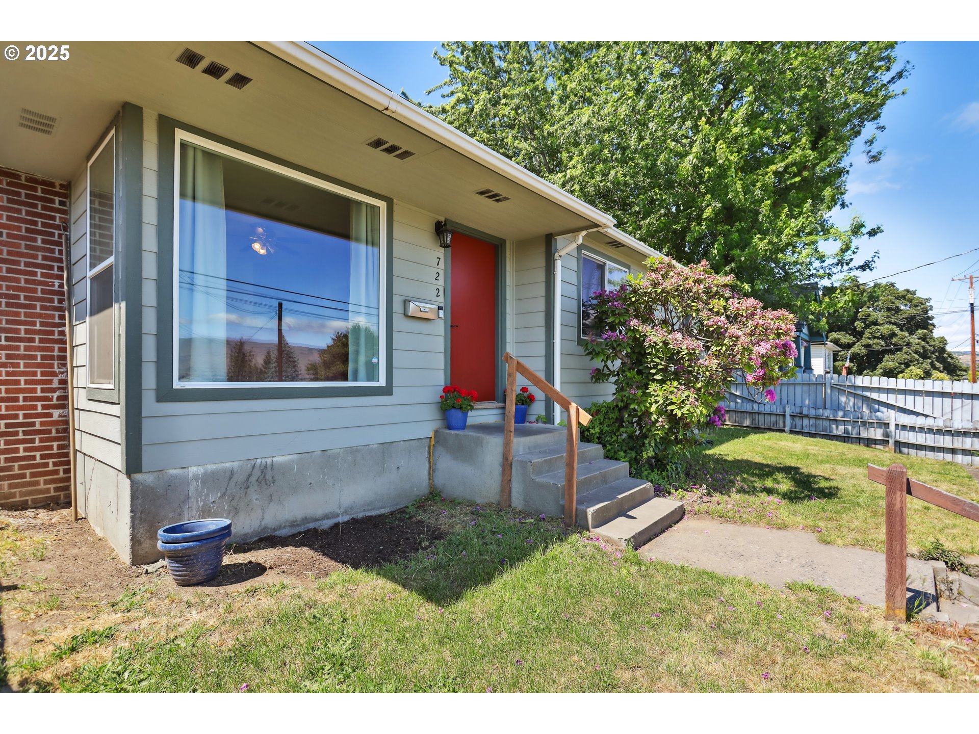 722 East 14th Street The Dalles, OR 97058 - Photo 3 of 43 a view of house with backyard outdoor seating and entertaining space