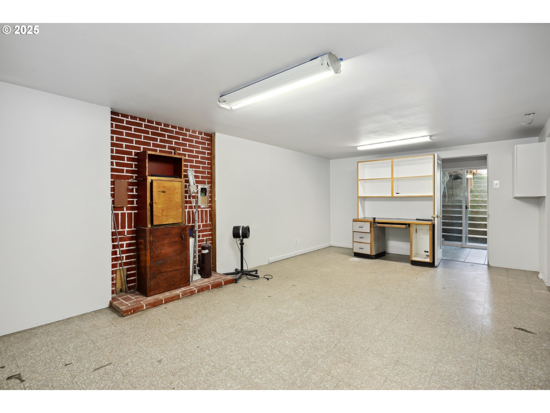 722 East 14th Street The Dalles, OR 97058 - Photo 32 of 43 a view of an empty room with a fireplace