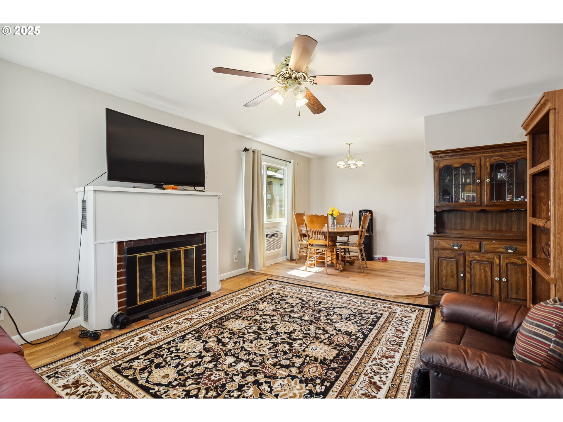 722 East 14th Street The Dalles, OR 97058 - Photo 5 of 43 a living room with furniture and a fireplace