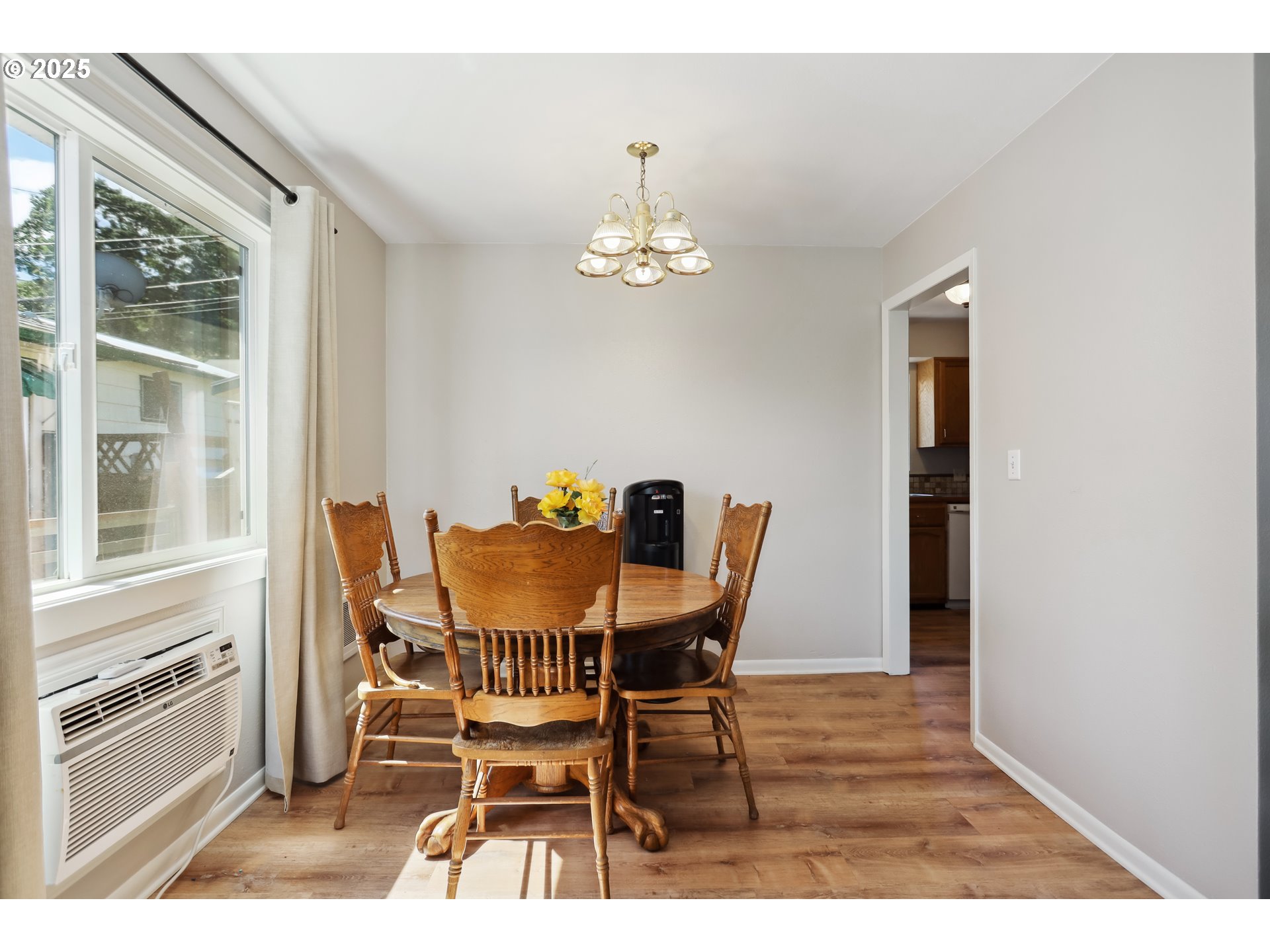 722 East 14th Street The Dalles, OR 97058 - Photo 7 of 43 a view of a dining room with furniture window and wooden floor