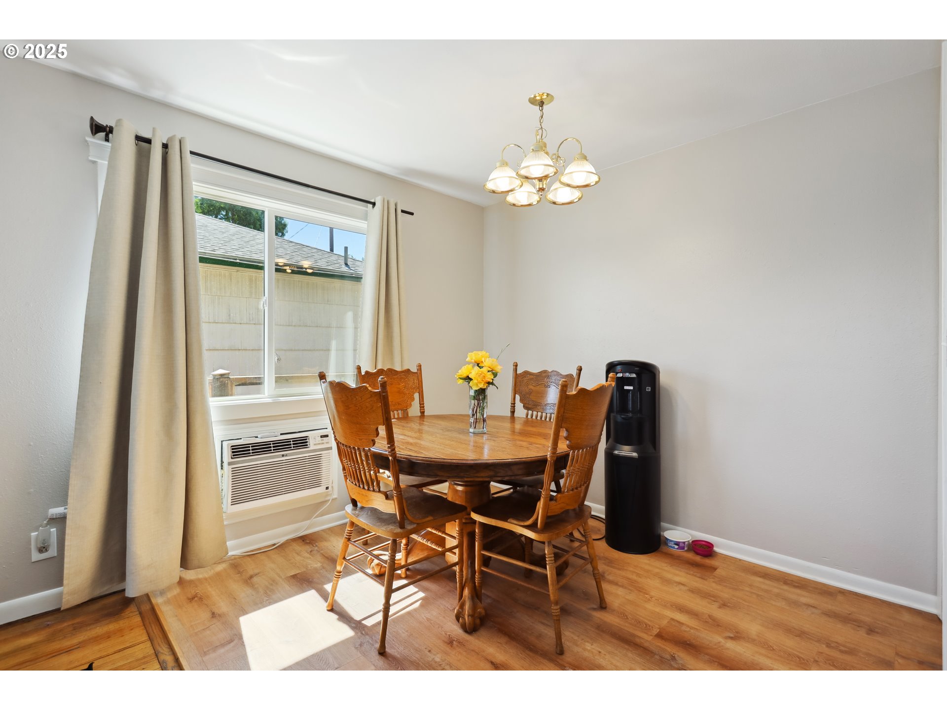 722 East 14th Street The Dalles, OR 97058 - Photo 8 of 43 a view of a dining room with furniture and chandelier