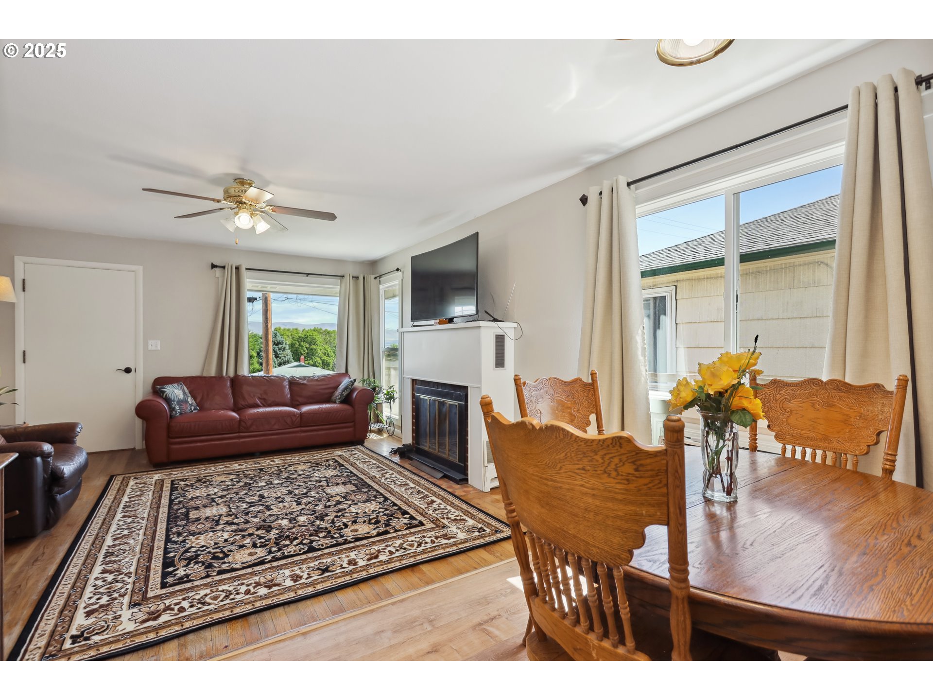 722 East 14th Street The Dalles, OR 97058 - Photo 9 of 43 a living room with furniture and a fireplace