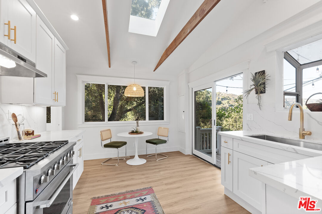 20939 Hillside Drive Topanga, CA 90290 - Photo 11 of 53 a living room with furniture wooden floor and a large window
