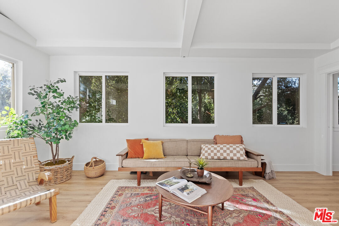 20939 Hillside Drive Topanga, CA 90290 - Photo 14 of 53 a living room with furniture and wooden floor