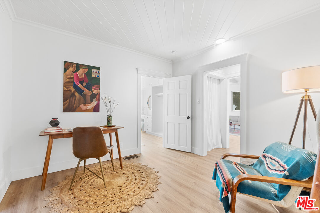 20939 Hillside Drive Topanga, CA 90290 - Photo 16 of 53 a living room with furniture and a wooden floor