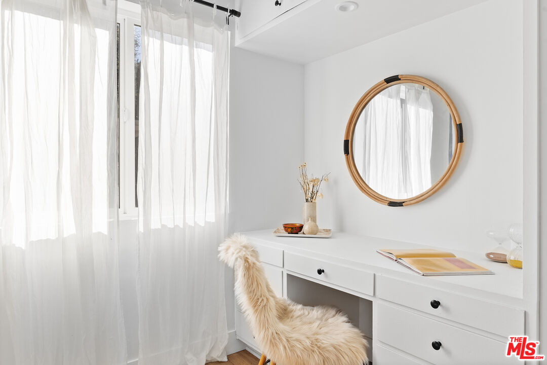 20939 Hillside Drive Topanga, CA 90290 - Photo 19 of 53 a bathroom with a sink mirror and vanity