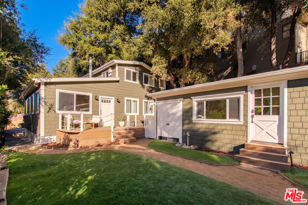 20939 Hillside Drive Topanga, CA 90290 - Photo 2 of 53 a front view of a house with a yard