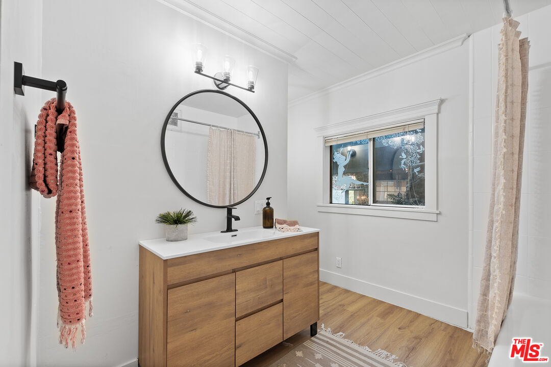 20939 Hillside Drive Topanga, CA 90290 - Photo 21 of 53 a bathroom with a sink and a mirror