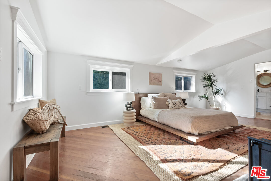 20939 Hillside Drive Topanga, CA 90290 - Photo 23 of 53 a bed room with a bed and a window