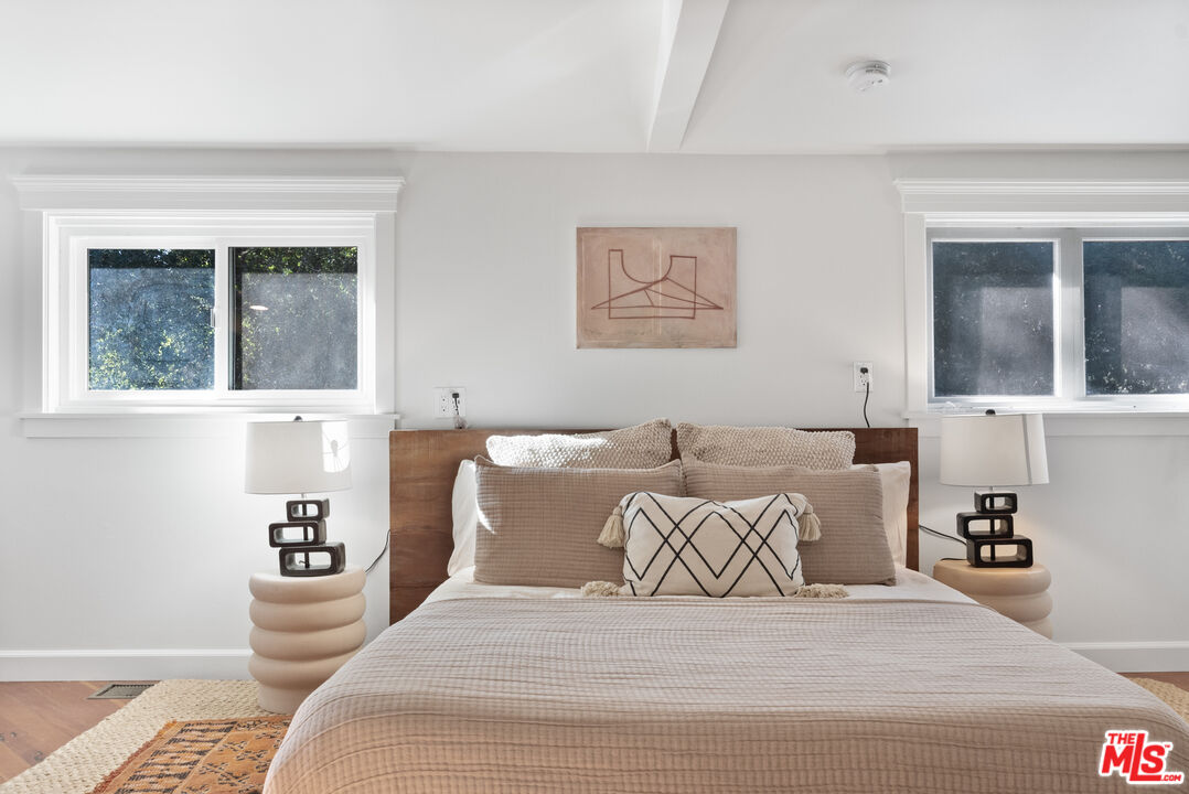 20939 Hillside Drive Topanga, CA 90290 - Photo 25 of 53 a bedroom with a large bed and a window