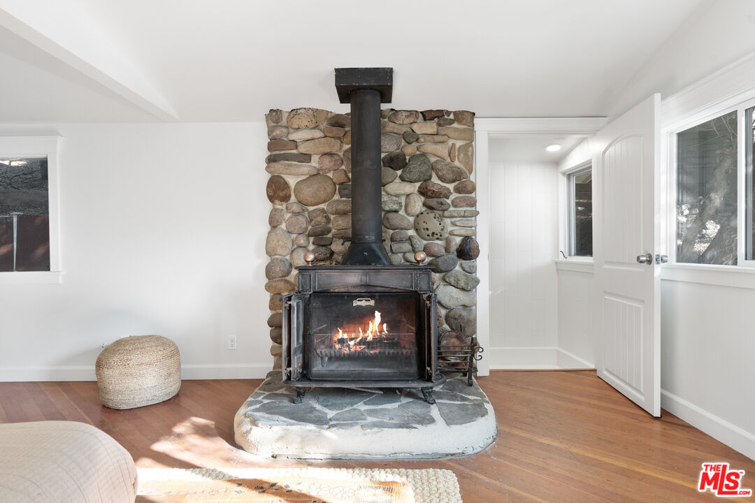 20939 Hillside Drive Topanga, CA 90290 - Photo 26 of 53 a living room with furniture and a fireplace