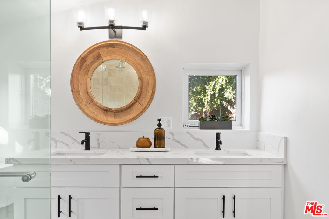20939 Hillside Drive Topanga, CA 90290 - Photo 28 of 53 a bathroom with a sink and a mirror