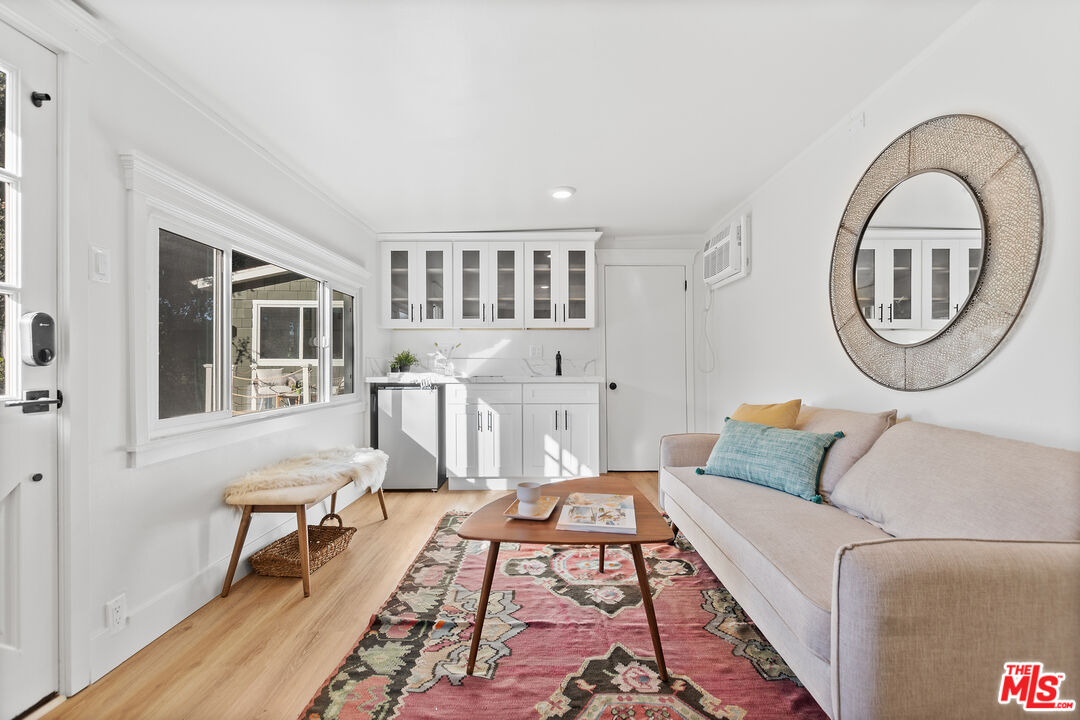 20939 Hillside Drive Topanga, CA 90290 - Photo 31 of 53 a living room with furniture and a dining table