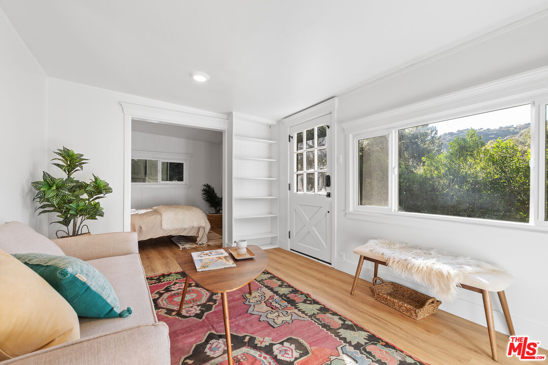 20939 Hillside Drive Topanga, CA 90290 - Photo 33 of 53 a living room with furniture and a large window