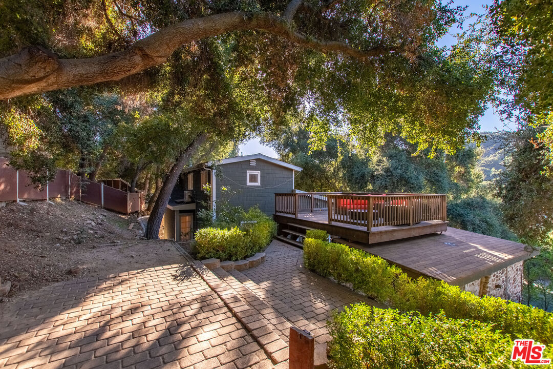 20939 Hillside Drive Topanga, CA 90290 - Photo 38 of 53 a view of a house with a yard and sitting area