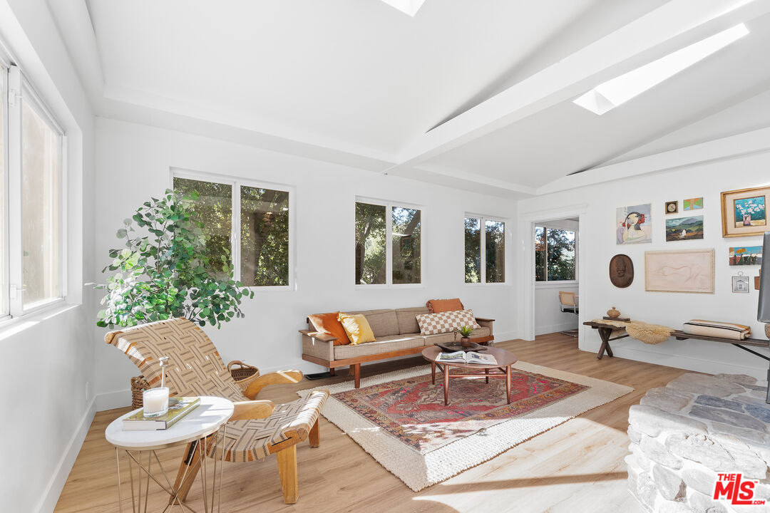 20939 Hillside Drive Topanga, CA 90290 - Photo 4 of 53 a living room with furniture and wooden floor