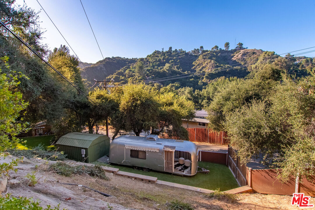 20939 Hillside Drive Topanga, CA 90290 - Photo 44 of 53 a view of a chairs and table in the backyard