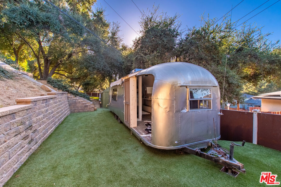 20939 Hillside Drive Topanga, CA 90290 - Photo 45 of 53 a view of backyard with a barn and a cactus plant