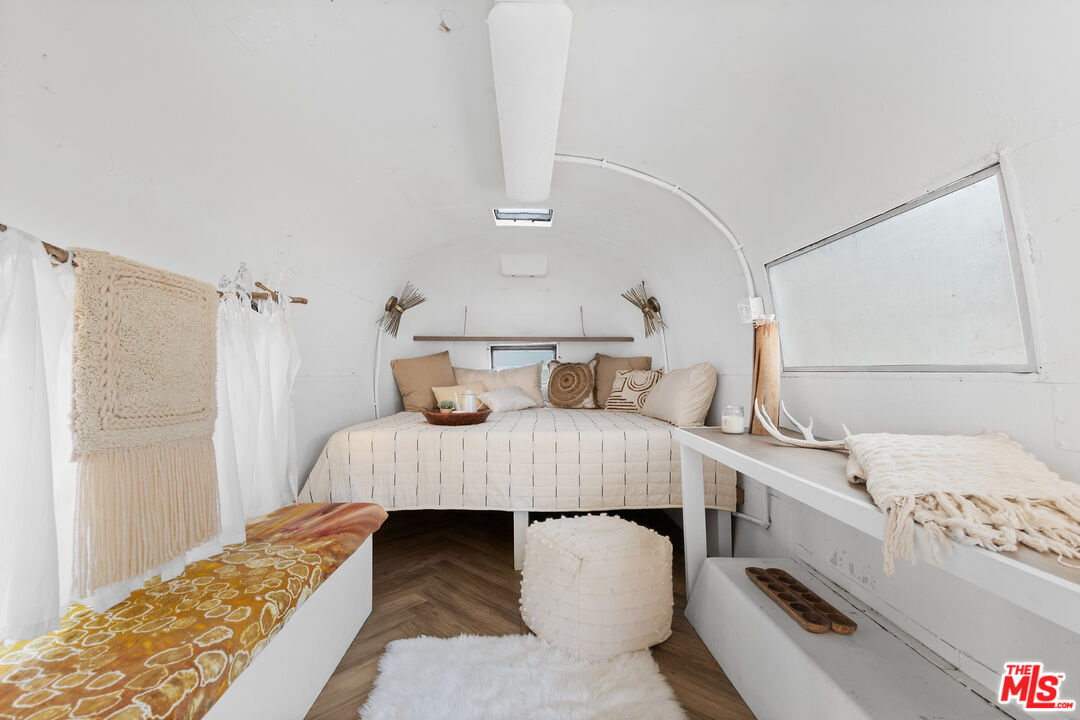 20939 Hillside Drive Topanga, CA 90290 - Photo 46 of 53 a bedroom with a bed and a window