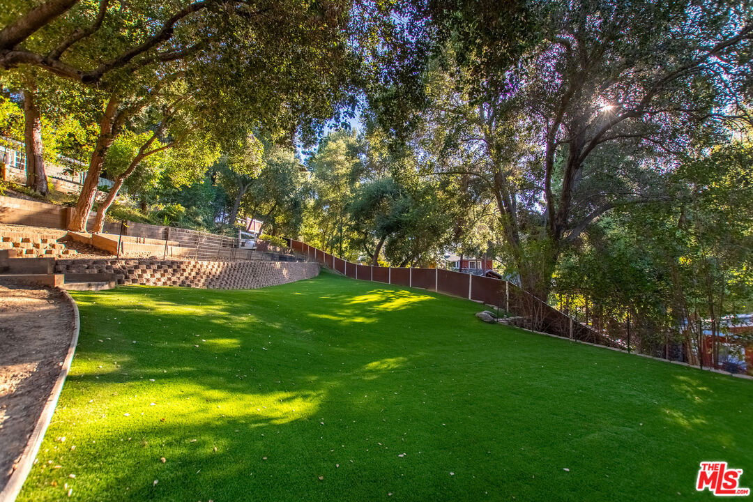 20939 Hillside Drive Topanga, CA 90290 - Photo 48 of 53 a view of a swimming pool with a yard
