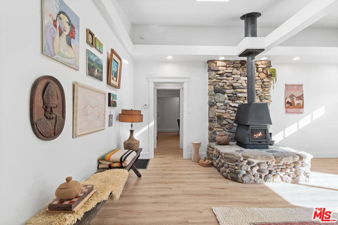 20939 Hillside Drive Topanga, CA 90290 - Photo 5 of 53 a living room with furniture and a fireplace