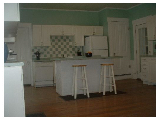 14754 West Eagle Point Road Polo, IL 61064 - Photo 3 of 11 a kitchen with cabinets and wooden floor