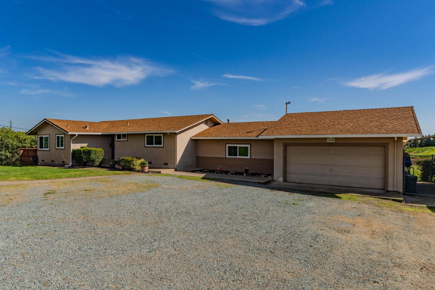 3050 Grapevine Gulch Road Ione, CA 95640 - Photo 3 of 36 a front view of a house with a yard