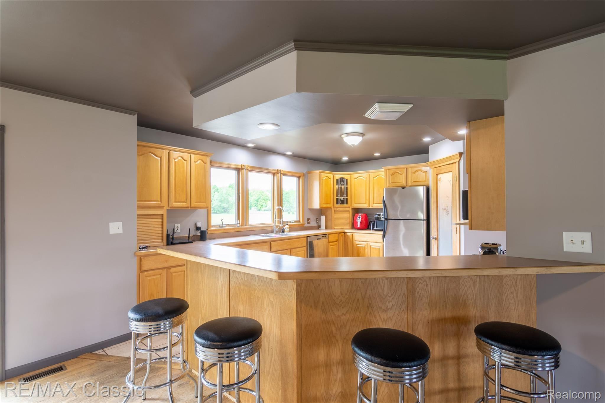 5765 Stanley Road Columbiaville, MI 48421 - Photo 7 of 40 Kitchen and bar area