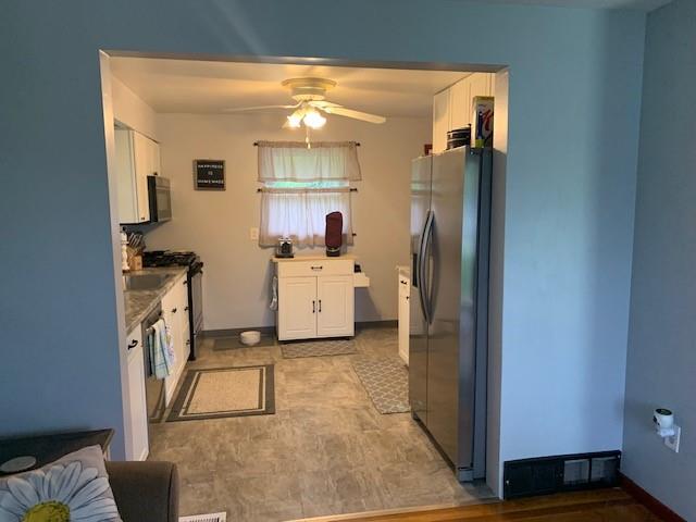 165 Ridge Avenue Freedom, PA 15042 - Photo 7 of 19 a kitchen with a sink refrigerator and cabinets