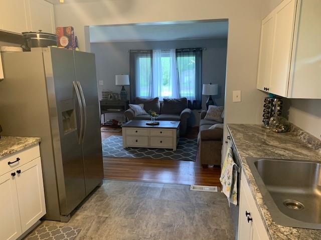 165 Ridge Avenue Freedom, PA 15042 - Photo 8 of 19 a kitchen with stainless steel appliances granite countertop a refrigerator a stove and a sink