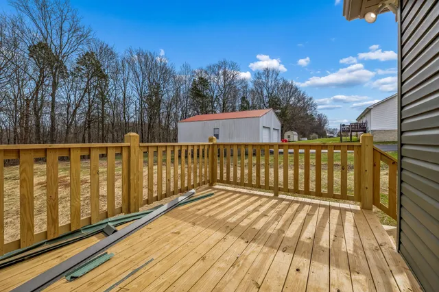 a balcony with wooden floor