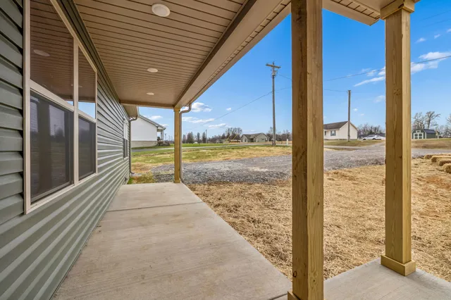 a view of a balcony with next to a yard