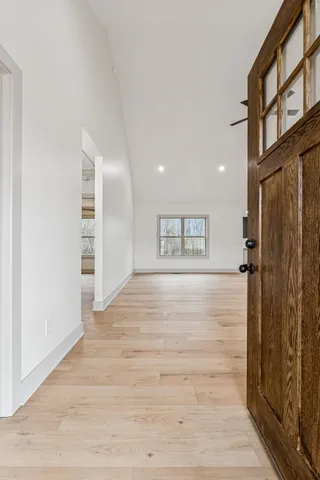 a view of an empty room with a window