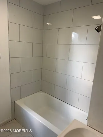a view of a bathtub in a bathroom