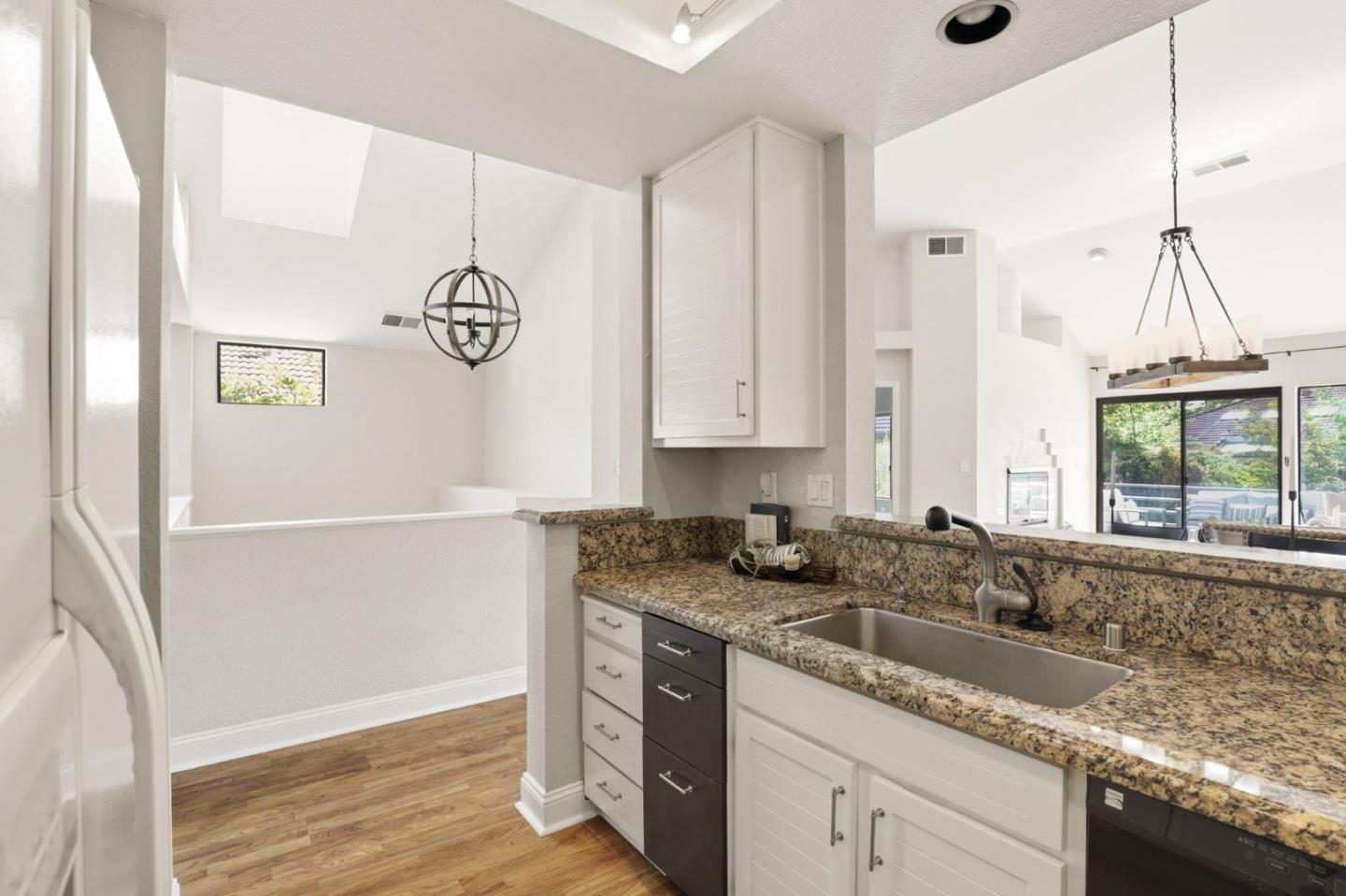 719 Lakemont Place, Unit 3 San Ramon, CA 94582 - Photo 16 of 50 a kitchen with granite countertop stainless steel appliances a sink window and cabinets