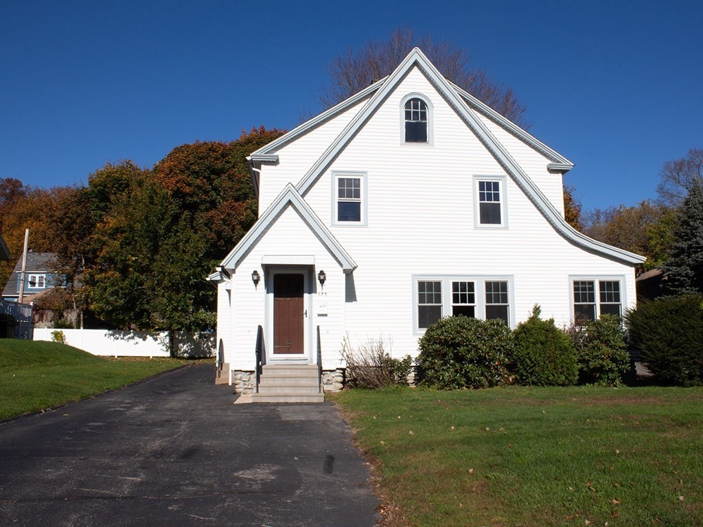 175 June Street Worcester, MA 01602 - Photo 1 of 30 a view of a white house next to a yard with big trees