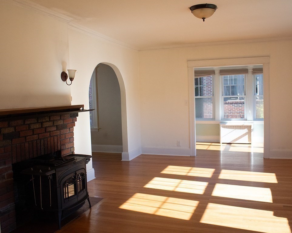 175 June Street Worcester, MA 01602 - Photo 12 of 30 a view of a livingroom with wooden floor and a large window