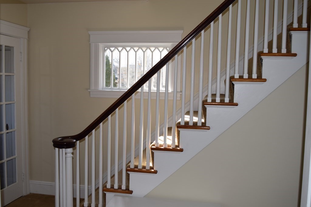 175 June Street Worcester, MA 01602 - Photo 15 of 30 a view of entryway with wooden floor and stairs