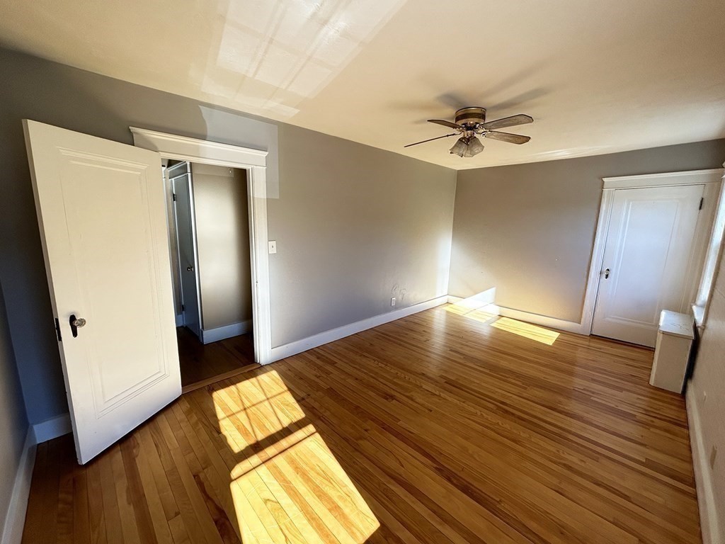 175 June Street Worcester, MA 01602 - Photo 21 of 30 wooden floor in an empty room with a window
