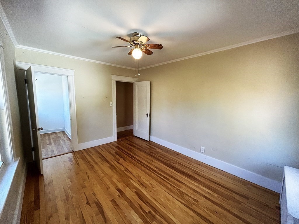 175 June Street Worcester, MA 01602 - Photo 23 of 30 a view of empty room with wooden floor and fan