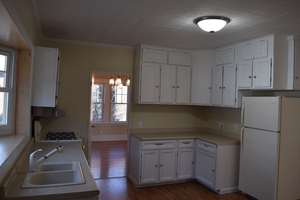 175 June Street Worcester, MA 01602 - Photo 7 of 30 a kitchen with cabinets appliances and a window