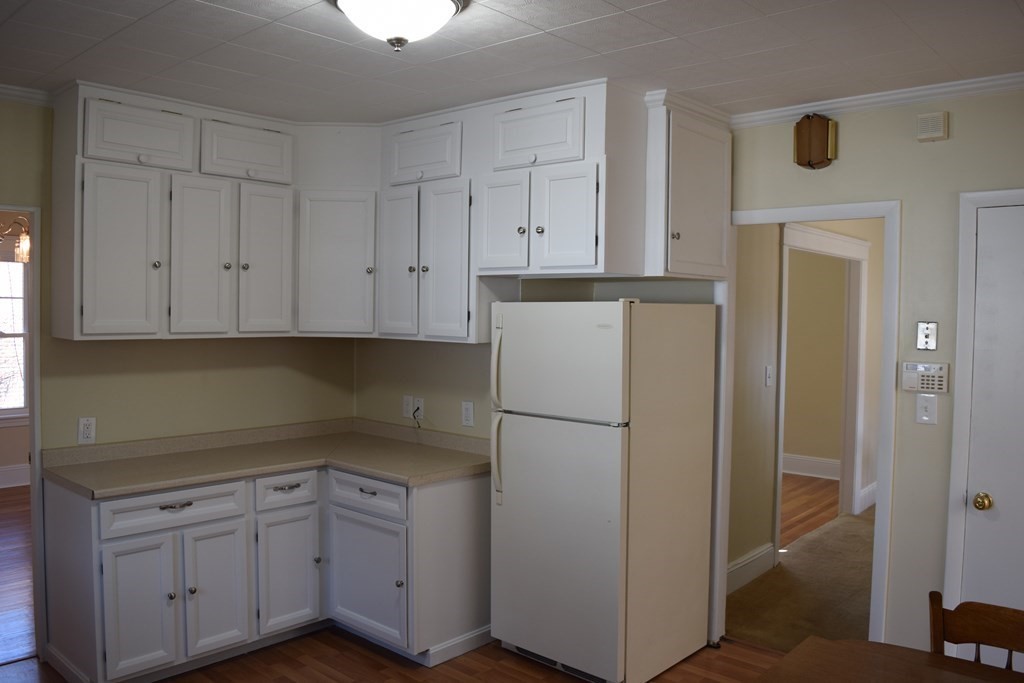 175 June Street Worcester, MA 01602 - Photo 8 of 30 a kitchen with cabinets appliances and a window