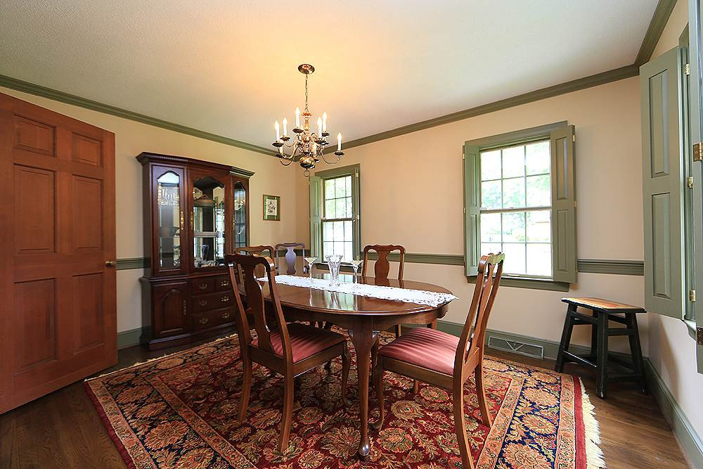 Formal dining room right off kitchen. Shutters, hdwds, crown and chair mldgs Dining Room
