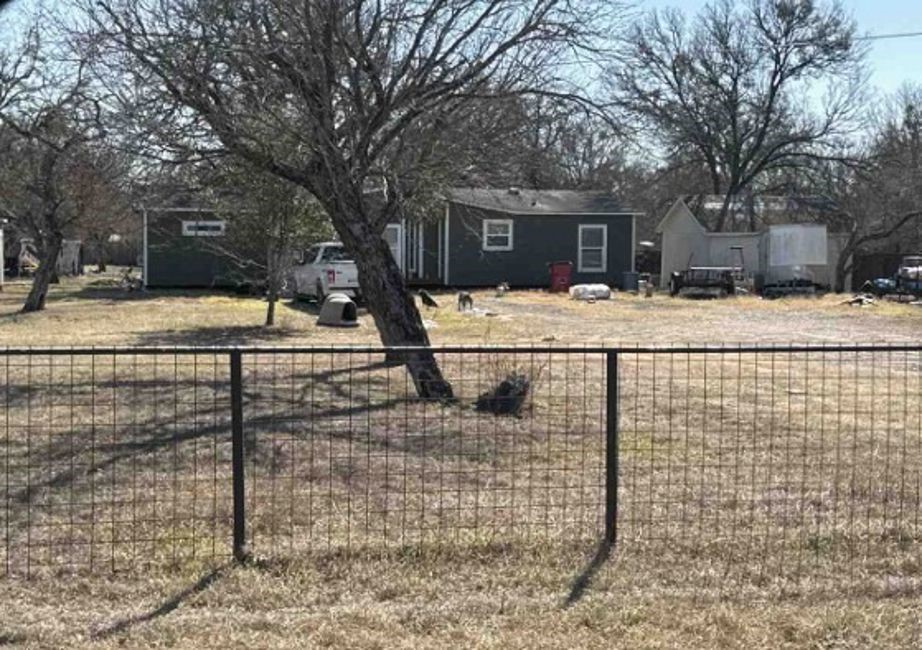 851 Old San Antonio Road Dale, TX 78616 - Photo 2 of 6 a house with trees in front of it
