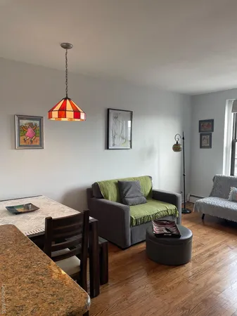 a living room with furniture and a table